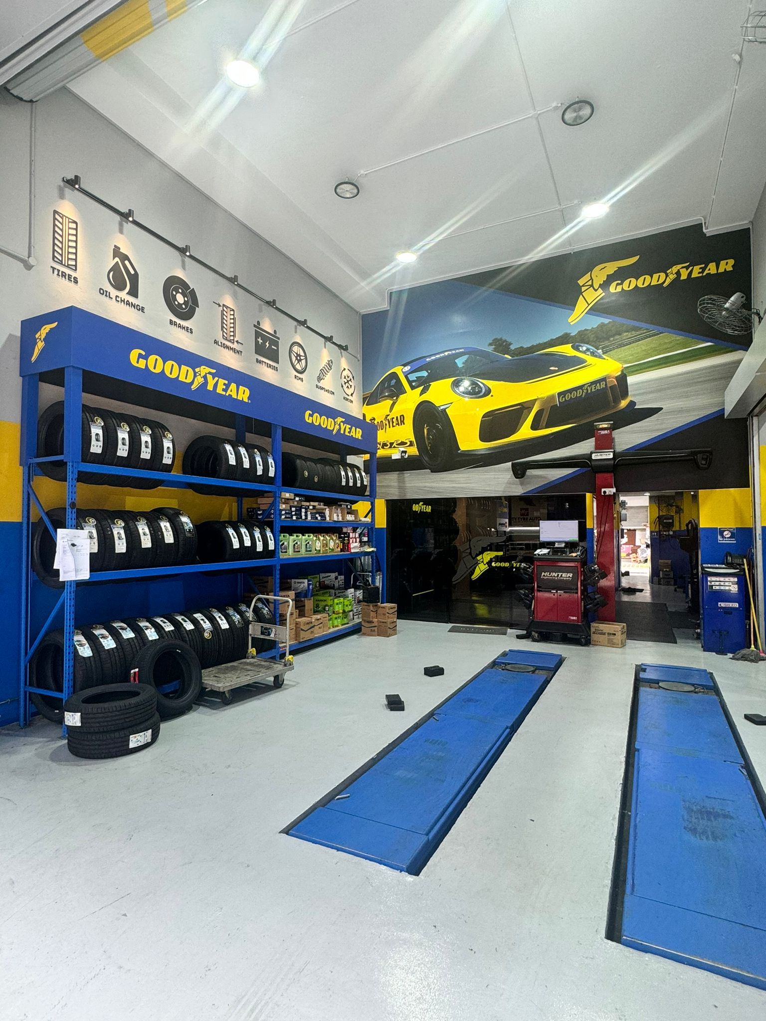 City Tyre Auto Kaki Bukit service bay with car on hydraulic lift during tyre replacement