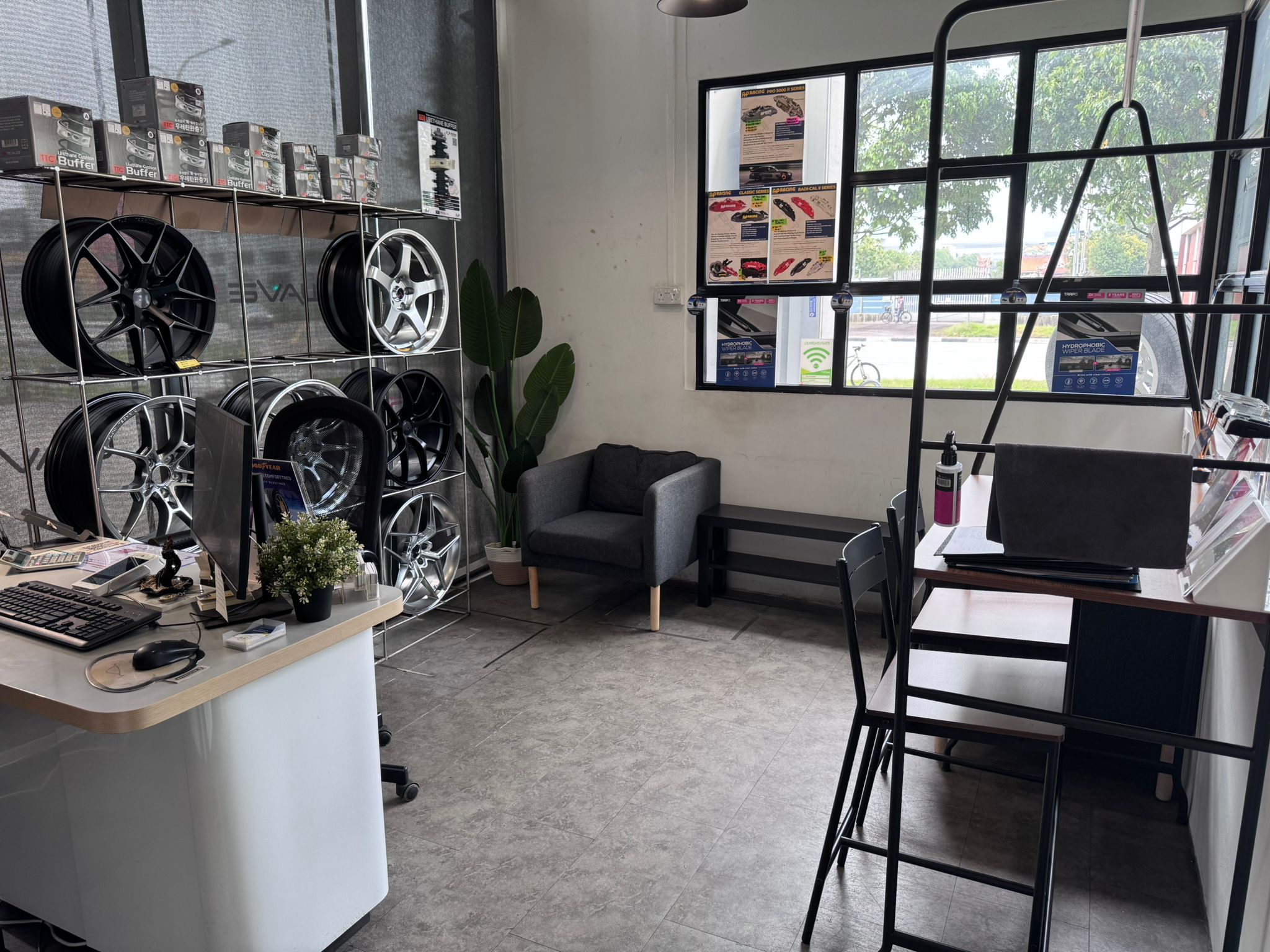 Air-conditioned customer waiting area at TYREPLUS Woodlands tyre shop with comfortable seating