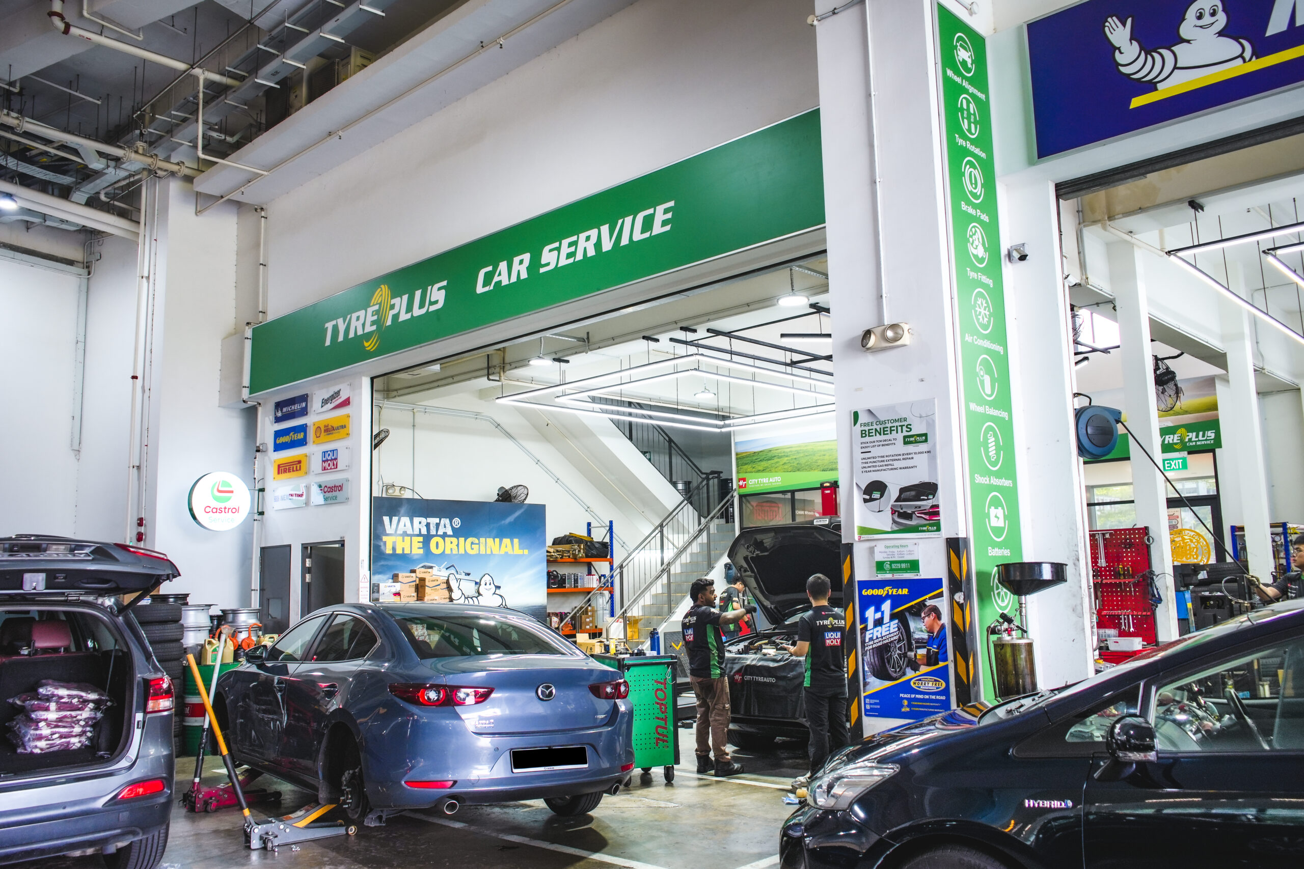 Precision wheel alignment in progress at TYREPLUS Jurong car workshop