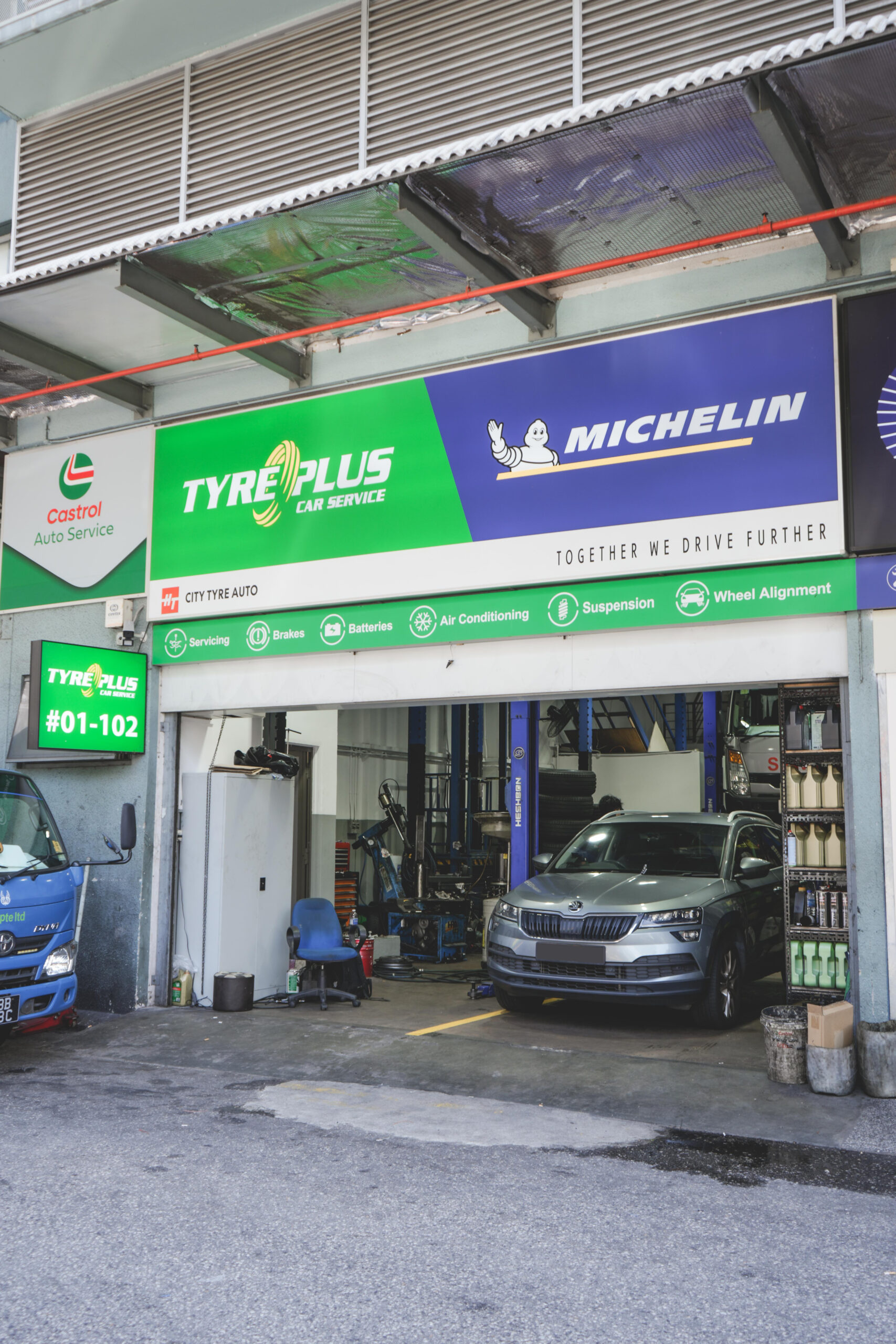 TYREPLUS Toh Guan Michelin-certified tyre shop and car workshop exterior at 48 Toh Guan Road East — open Sundays, near Jurong East MRT and IMM
